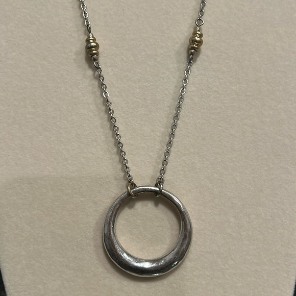 Silver and gold colored circle pendant necklace. Adjustable to 2 lengths. - Picture 2 of 6